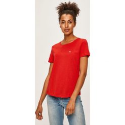 Tommy Jeans - T-shirt. Pomarańczowe bluzki damskie Tommy Jeans, s, bez wzorów, z bawełny, z okrągłym kołnierzem. W wyprzedaży za 99,90 zł.