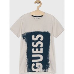 Guess Jeans - T-shirt dziecięcy 118-175 cm. Niebieskie t-shirty chłopięce Guess Jeans, z nadrukiem, z bawełny, bez rękawów. W wyprzedaży za 59,90 zł.
