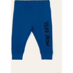 Blukids - Spodnie dziecięce 68-98 cm. Niebieskie spodnie chłopięce Blukids, z nadrukiem, z bawełny, sportowe. Za 29,90 zł.