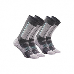 Skarpety turystyczne SH520 X-WARM mid. Niebieskie skarpetki męskie marki QUECHUA, z elastanu. Za 59,99 zł.