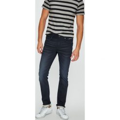 Guess Jeans - Jeansy Angels. Niebieskie jeansy męskie Guess Jeans, m, z aplikacjami. W wyprzedaży za 299,90 zł.