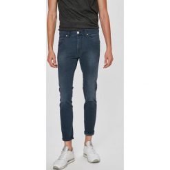 Wrangler - Jeansy Stralngler. Niebieskie jeansy męskie skinny marki Wrangler, z bawełny. W wyprzedaży za 219,90 zł.