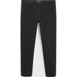 Mango Kids - Spodnie dziecięce Alex 116-164 cm. Szare spodnie chłopięce Mango Kids, bez wzorów, z elastanu. W wyprzedaży za 71,90 zł.