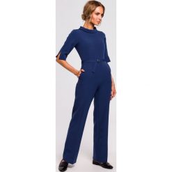 Kombinezon ze stójką - granatowy. Niebieskie kombinezony damskie Moe, na co dzień, s, bez wzorów, z elastanu, eleganckie, ze stójką, bez rękawów. Za 189,00 zł.
