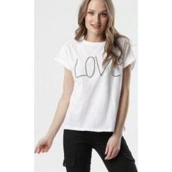 Biały T-shirt Phaino. Białe bluzki damskie Born2be, s, z aplikacjami, z jeansu, klasyczne, z okrągłym kołnierzem, z krótkim rękawem. Za 49,99 zł.