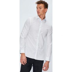 Guess Jeans - Koszula Almeda. Niebieskie koszule męskie Guess Jeans, s, z aplikacjami, z bawełny, eleganckie, z włoskim kołnierzykiem, z długim rękawem. W wyprzedaży za 189,90 zł.