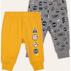 Blukids - Spodnie dziecięce 68-98 cm (2-pack). Żółte spodnie chłopięce Blukids, bez wzorów, z bawełny, casualowe. W wyprzedaży za 49,90 zł.