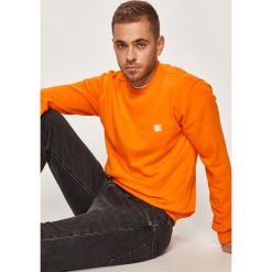 DC - Bluza. Pomarańczowe bluzy męskie DC, s, bez wzorów, z bawełny, z okrągłym kołnierzem, bez rękawów, bez kaptura. W wyprzedaży za 149,90 zł.