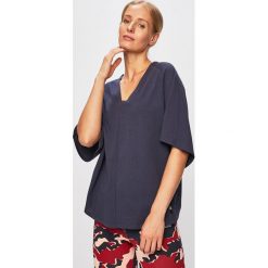 Reebok - T-shirt. Niebieskie t-shirty damskie Reebok, s, bez wzorów, z bawełny, bez kołnierzyka. W wyprzedaży za 89,90 zł.