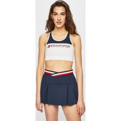 Tommy Sport - Biustonosz. Białe biustonosze sportowe damskie Tommy Sport, s, z nadrukiem, z elastanu. W wyprzedaży za 129,90 zł.