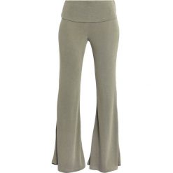 Free People DIVISION FLARE Spodnie treningowe army. Pomarańczowe spodnie damskie marki Free People, xs, z poliesteru. Za 349,00 zł.