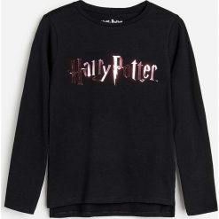 Bawełniana koszulka Harry Potter - Czarny. Czarne koszulki damskie Reserved, bez wzorów, z bawełny, bez kołnierzyka, bez rękawów. Za 35,99 zł.