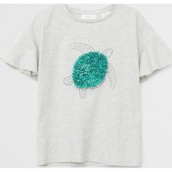 Mango Kids - T-shirt dziecięcy Marea 110-164 cm. Szare bluzki dziewczęce Mango Kids, z aplikacjami, z bawełny, z okrągłym kołnierzem, z krótkim rękawem, krótkie, bez kaptura. Za 49,90 zł.