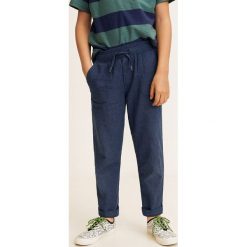 Mango Kids - Spodnie dziecięce Nico 110-164 cm. Niebieskie spodnie chłopięce Mango Kids, bez wzorów, z bawełny, casualowe. W wyprzedaży za 49,90 zł.