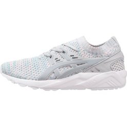 Asics Tiger GELKAYANO TRAINER KNIT Tenisówki i Trampki glacier grey/mid grey. Szare tenisówki damskie Asics Tiger, z tworzywa sztucznego. W wyprzedaży za 235,60 zł.
