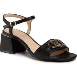 Sandały AIGNER - Hanna 2A 1201810 Black 001. Czarne klapki damskie Aigner, bez wzorów, ze skóry, bez obcasa, na obcasie. W wyprzedaży za 549,00 zł.
