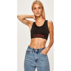 Guess Jeans - Biustonosz sportowy. Czerwone biustonosze sportowe damskie Guess Jeans, s, z nadrukiem, z elastanu. Za 169,90 zł.