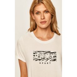 Dkny - T-shirt. Białe topy damskie DKNY, s, z nadrukiem, z elastanu, casualowe, z okrągłym kołnierzem. W wyprzedaży za 159,90 zł.