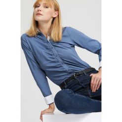 Niebieska Koszula Where We Start. Niebieskie koszule body marki other, xl, eleganckie, z okrągłym kołnierzem. Za 59,99 zł.