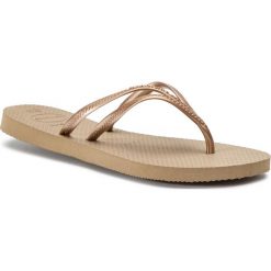 Japonki HAVAIANAS - H. Nova Tria 41411973581 Rose Gold. Żółte klapki damskie Havaianas, bez wzorów, z tworzywa sztucznego, bez obcasa. W wyprzedaży za 69,00 zł.