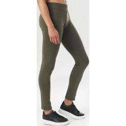 Khaki Legginsy Helerris. Brązowe legginsy damskie Born2be, s, bez wzorów. Za 39,99 zł.