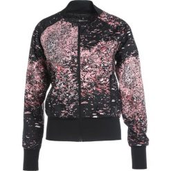 Skins INTERLECT Kurtka do biegania stardust flamingo. Czerwone kurtki damskie do biegania Skins, s, z materiału. W wyprzedaży za 209,50 zł.