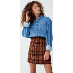 Minispódniczka paperbag w kratkę. Pomarańczowe spódniczki damskie marki Pull&Bear, w kratkę. Za 59,90 zł.