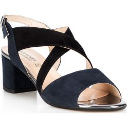 Buty damskie. Pomarańczowe klapki damskie Wittchen, w paski, ze skóry, na wysokim obcasie, na obcasie. W wyprzedaży za 199,90 zł.