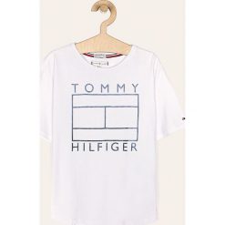Tommy Hilfiger - T-shirt dziecięcy 128-176 cm. Białe bluzki dziewczęce TOMMY HILFIGER, z nadrukiem, z bawełny, z okrągłym kołnierzem, z krótkim rękawem, krótkie, bez kaptura. Za 129,90 zł.