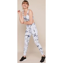 Undiz - Biustonosz sportowy Yogamarbliz. Białe biustonosze sportowe damskie Undiz, s, bez wzorów, z elastanu. W wyprzedaży za 49,90 zł.
