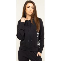 Bluza Calvin Klein Performance 00GWH9W322. Czarne bluzy damskie Calvin Klein Performance, s, bez wzorów, z bawełny, bez rękawów, bez kaptura. W wyprzedaży za 259,00 zł.
