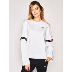 Bluza EA7 Emporio Armani 3HTM15 TJU6Z 1100. Białe bluzy damskie EA7 Emporio Armani, s, bez wzorów, z elastanu, bez rękawów, bez kaptura. W wyprzedaży za 389,00 zł.