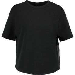 Nike Performance Koszulka sportowa black. Czarne topy sportowe damskie Nike Performance, xs, z bawełny. W wyprzedaży za 209,25 zł.