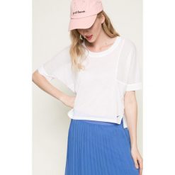 Nike - Top. Białe topy damskie marki Nike, xs, z elastanu, z okrągłym kołnierzem. W wyprzedaży za 99,90 zł.