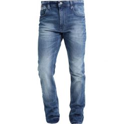 Tommy Jeans ORIGINAL TAPERED RONNIE BEMB Jeansy Zwężane berry mid blue. Niebieskie jeansy męskie marki Tommy Jeans. W wyprzedaży za 359,20 zł.