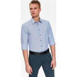 Koszula wzorzysta o kroju slim. Szare koszule męskie Top Secret, na zimę, m, bez wzorów, z tkaniny, klasyczne, z klasycznym kołnierzykiem, bez rękawów. W wyprzedaży za 44,99 zł.