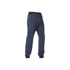 Spodnie dresowe slim Gym & Pilates 530 męskie. Czarne spodnie męskie DOMYOS, s, bez wzorów, z elastanu. Za 99,99 zł.