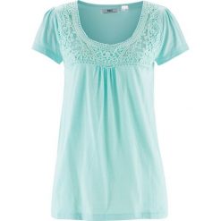 Shirt bawełniany z koronką i krótkim rękawem bonprix lodowy miętowy. Niebieskie koszulki damskie bonprix, w koronkowe wzory, z bawełny, bez kołnierzyka, z krótkim rękawem. Za 54,99 zł.