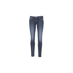 Jeansy slim fit Diesel GRACEY. Niebieskie jeansy damskie Diesel, bez wzorów, z jeansu. Za 527,20 zł.