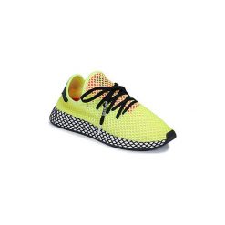 Buty adidas DEERUPT RUNNER. Żółte trampki męskie Adidas, bez wzorów, bez zapięcia. Za 343,20 zł.