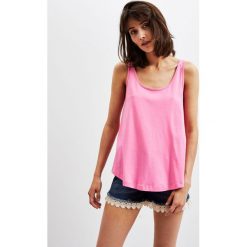 Top typu oversize. Różowe bluzki damskie Moodo, xs, bez wzorów, bez kołnierzyka, bez rękawów. Za 9,99 zł.