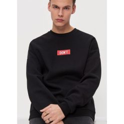 Bluza oversize - Czarny. Czarne bluzy damskie House, m, bez wzorów, bez rękawów, bez kaptura. W wyprzedaży za 29,99 zł.