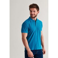 Koszulka polo w kolorze turkusowym. Niebieskie koszulki męskie TATUUM, xl, z haftami, z bawełny, polo, bez rękawów. W wyprzedaży za 64,95 zł.