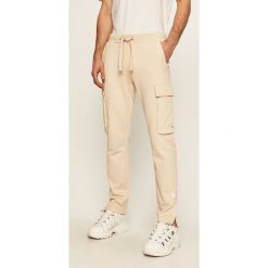 Tommy Hilfiger - Spodnie x Lewis Hamilton. Białe spodnie męskie TOMMY HILFIGER, s, bez wzorów, z bawełny. Za 649,90 zł.