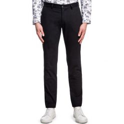 Spodnie RICCARDO SMCS030090. Czarne spodnie męskie Giacomo Conti, na co dzień, m, bez wzorów, z elastanu. Za 199,00 zł.