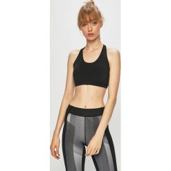 Reebok - Biustonosz sportowy. Czarne biustonosze sportowe damskie Reebok, s, bez wzorów, z elastanu. W wyprzedaży za 79,90 zł.