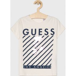 Guess Jeans - Top dziecięcy 118-175 cm. Bluzki dziewczęce Guess Jeans, z nadrukiem, z elastanu, z okrągłym kołnierzem, z krótkim rękawem, krótkie, bez kaptura. Za 79,90 zł.