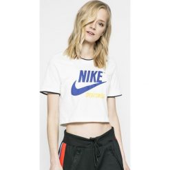 Nike Sportswear - Top. Białe topy damskie marki Nike Sportswear, s, z nadrukiem, z elastanu, z okrągłym kołnierzem. W wyprzedaży za 119,90 zł.