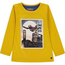 Koszulka w kolorze żółtym. Żółte t-shirty chłopięce Kanz, z nadrukiem, z bawełny, z długim rękawem. W wyprzedaży za 32,95 zł.