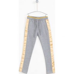 Lemon Explore - Spodnie dziecięce 122-164 cm. Szare spodnie dziewczęce marki LEMON explore, bez wzorów, z bawełny, sportowe. W wyprzedaży za 39,90 zł.